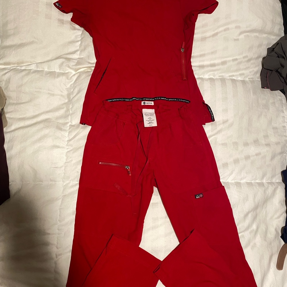 Koi Stretch light scrubs. Size xxs. Red in color